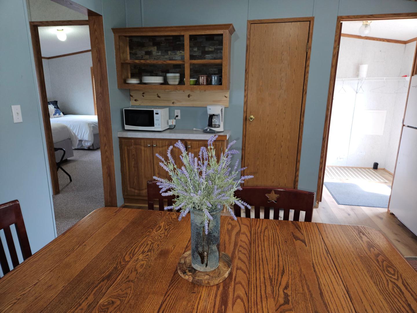 Dining room with a lavender plant placed in the middle of the table