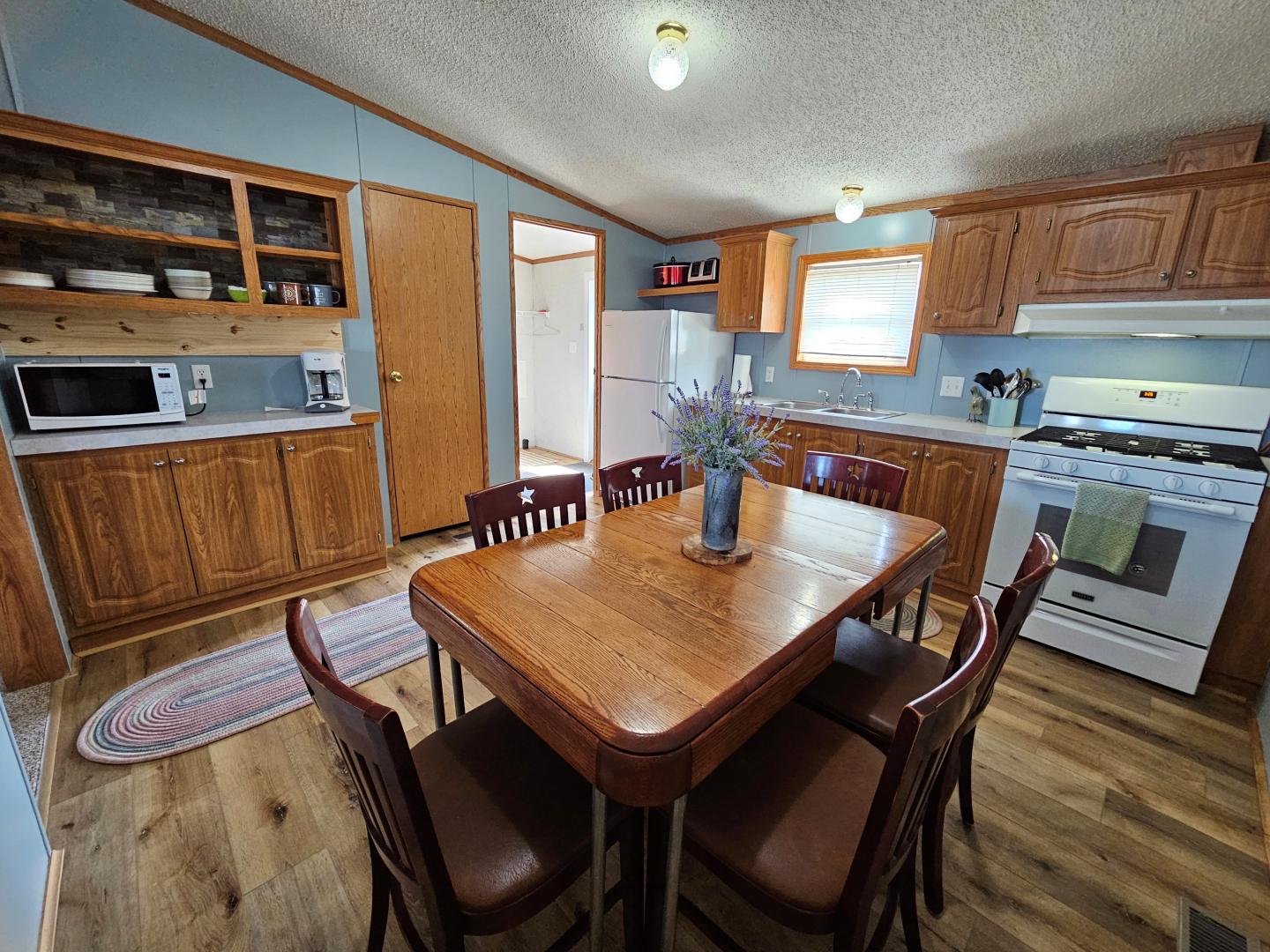 Wide angle view of dining room and kitchen area